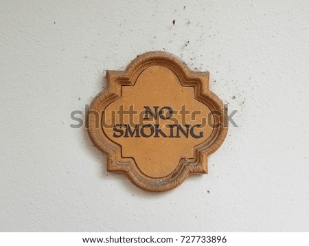 no smoking sign on white wall