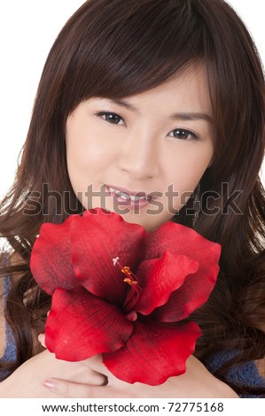 Asian girl holding red flower and looking at you, closeup portrait.