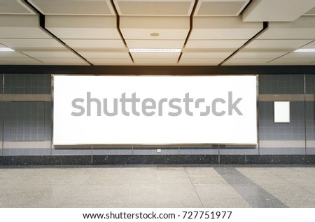 mock up blank billboard with copy space for advertising or media and content marketing at train station, marketing and advertising concept