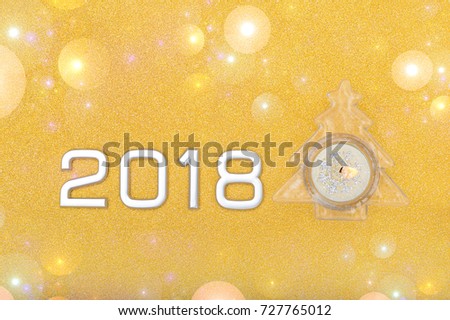 Happy new year 2018 text Gold holiday abstract glitter background with blinking stars. Blurred bokeh of Christmas lights