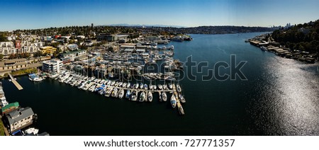 A panorama of Lake Union from an aerial view with boats and a park
