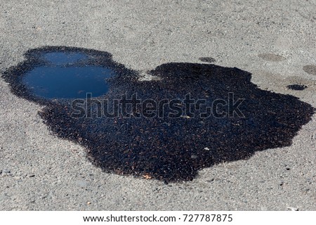 Oil on the asphalt Royalty-Free Stock Photo #727787875