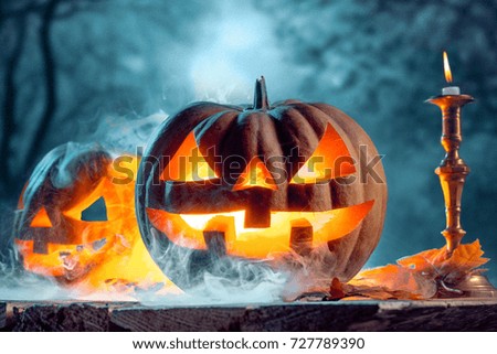 Halloween pumpkins on blue background