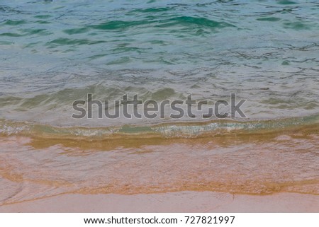 Ocean, waves, beach and sand. Natural textures of the surface of water and sand. The coast of Indian Ocean. Seychelles