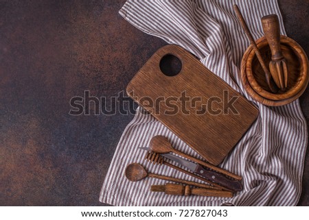 set of wooden utensils on a dark background, horizontal