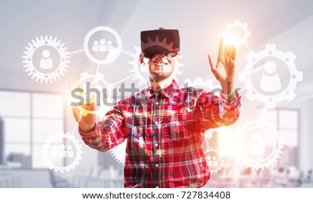 Young man with virtual reality headset or 3d glasses over social connection background