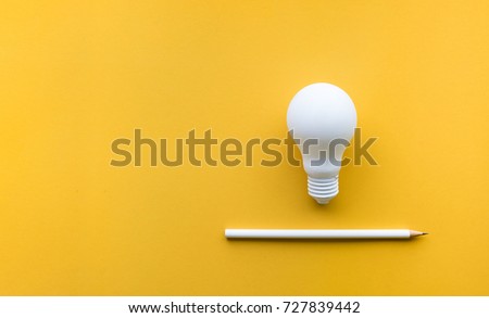 Creativity inspiration,ideas concepts with lightbulb and pencil on pastel color background.Flat lay design. Royalty-Free Stock Photo #727839442