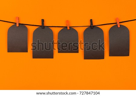 Halloween black blank labels tomb on orange background, mock up. Template for advertising, design, cover.