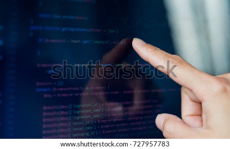 finger touch screen on monitor  Java code. Programming language screen
