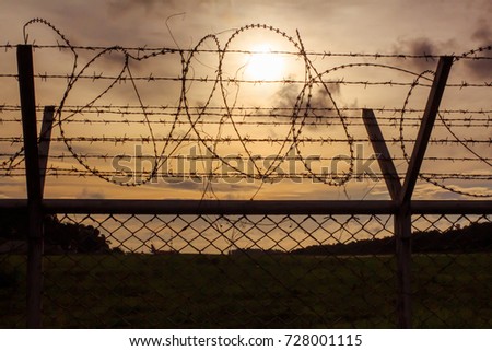 Prison imprisonment background, of war in prisons, barbed wire dark , Phuket, Thailand
