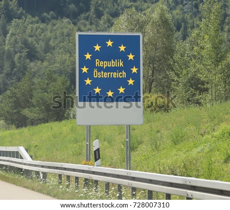 Austrian border and the road sign of the frontier with the stars of the European community