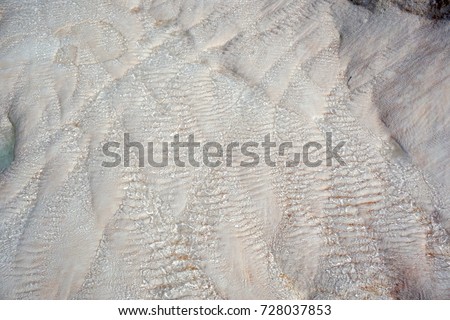 pure water flow on white stone. water texture