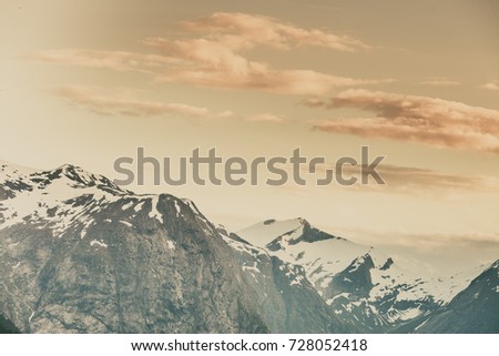 Tourism vacation and travel. Mountains landscape at summer and snowcapped mountain tops in the background, Norway, Scandinavia.