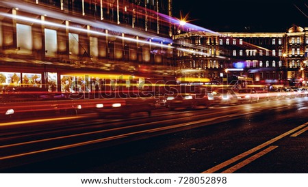 Blurred night traffic. Light trails on the road at night on Kamennoostrovskiy prospect in Saint-Petersburg, Russia