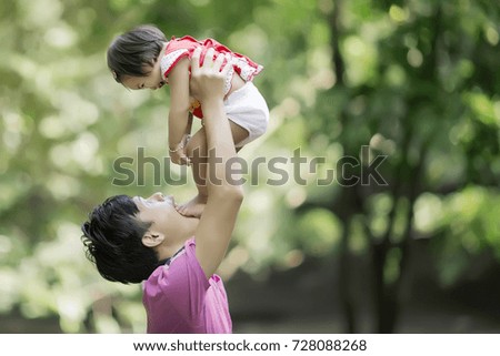 dad walks in the park with his beloved daughter . young family and newborn son .Happy family
