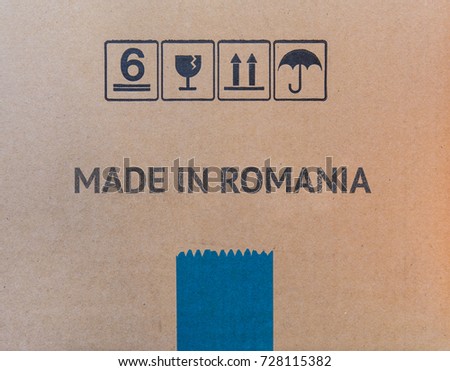 MADE IN ROMANIA written on brown cardboard box.
