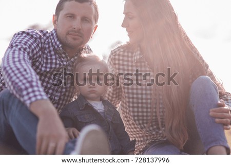 sunny pictures of happy family with dog and baby