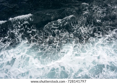 blue water waves in the sea. white spindrift.                      