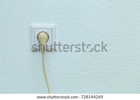 electric socket and cable on the wall in the room