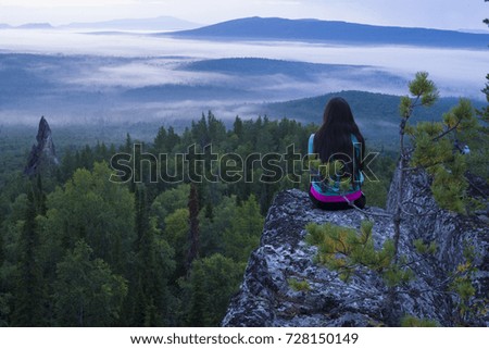 Man meditating yoga at sunset mountains Travel Lifestyle relaxation emotional concept adventure summer vacations outdoor harmony with nature