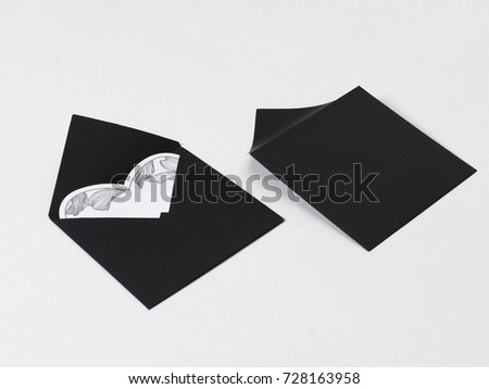 Black white and gray color mock-up of stationery, a template on a gray and white background. For presentations and portfolio of graphic designers. Envelopes, sheets of paper, hearts