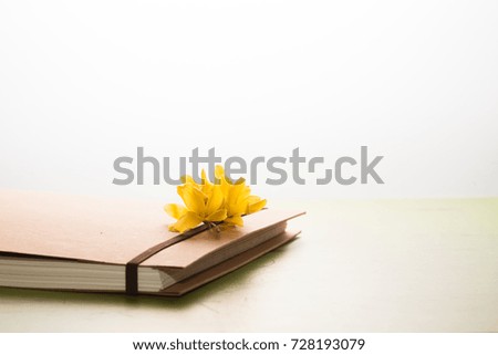 Note book with Golden Bells Plant Forsythia