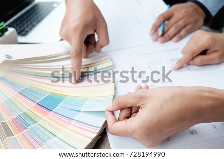 Architectural and Interior designer and Engineer team to meeting and select color for house project.