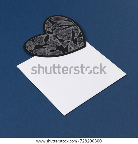 Blue, black and white color mock-up layout of stationery, a template for brand identification blue background. For presentations and portfolio of graphic designers. Envelopes,  paper, hearts.