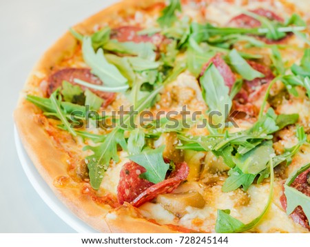 pizza with arugula and salami