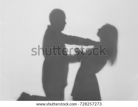 Silhouette of man trying to kill his wife on white background. Domestic violence concept Royalty-Free Stock Photo #728257273