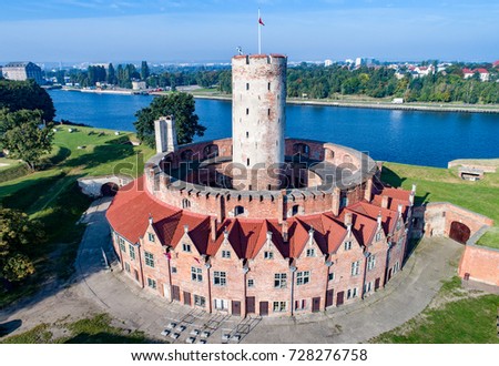 Gdansk, Poland. Medieval Wisloujscie Fortress with old lighthouse tower. 
A unique monument of the fortification works. Aerial view