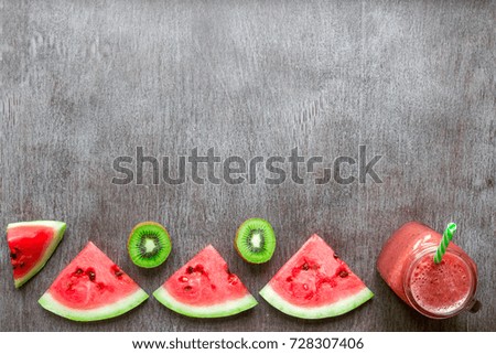 Smoothie of watermelon and kiwi on wooden background