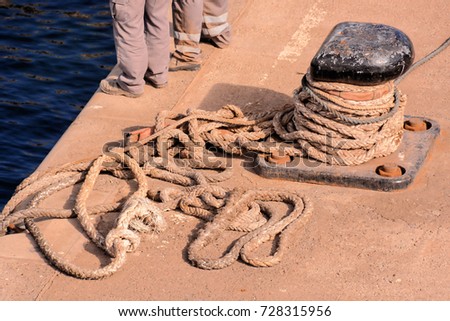 Photo picture of a Rusty metal mooring bolard for big ship