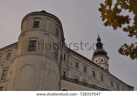 castle in the romantic , historic and beautiful town mikulov south moravia czech republic next to the yellow autumn leaves