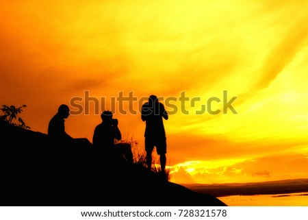 Silhouette photographer on mountain,Photographer shooting sunset,Beauty sunset,Shooting photographer with sunset public landmark