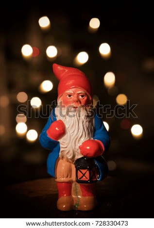 Old santa with christmas tree bokeh in background. 