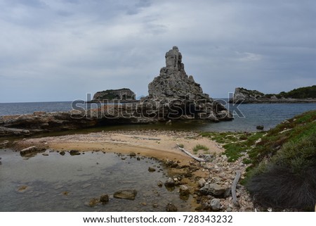 Blue sea and rocky outcrops, seashore of Pianosa Island, Italy 