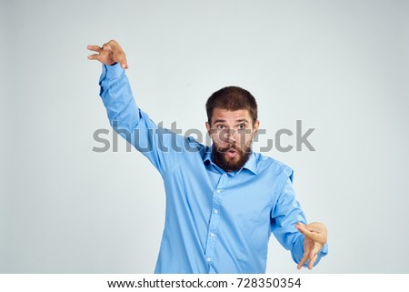 business man in a blue shirt on a light background                               