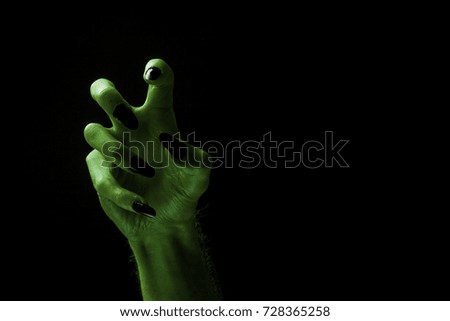 Halloween green witches or zombie monster hand
