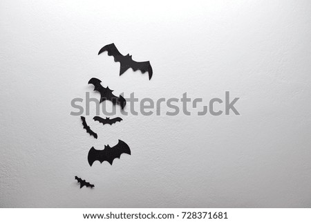 halloween decoration and scary concept - black bats flying white background