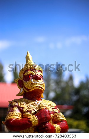 Red giant statue and sky picture 1