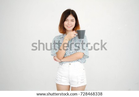 Portrait of thai adult beautiful girl short hair drinking coffee