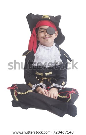 Asian boy smiling in pirate costume isolated over white