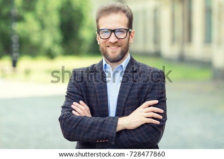 Portrait of an adult male 40 - 45 years old with glasses. Business man. Royalty-Free Stock Photo #728477860