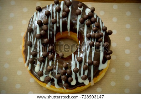 Chocolate "sufganiyah" (Hebrew word) - a round chocolate donut eaten in Israel and around the world on the Jewish festival of Hanukkah