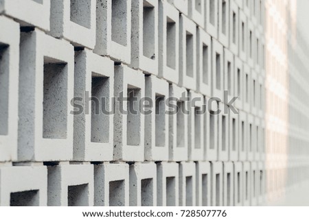 background texture- white square brick wall with depth of field and strip of sunlight