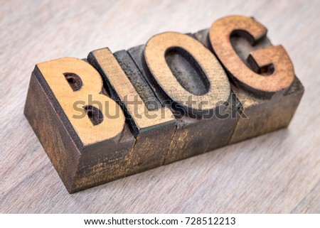 blog word abstract in vintage letterpress printing blocks against grained wood
