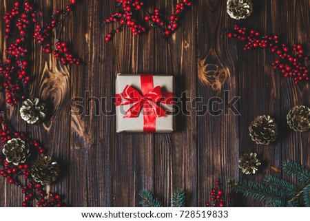 Christmas present on a wooden table background