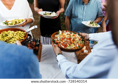 Street food at the wedding or another catered event dinner. Royalty-Free Stock Photo #728540314