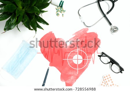 Red health. Workplace of doctor - stethoscope, medical items and pills on desk